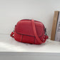 Kleine, runde Mini-Tasche aus PU