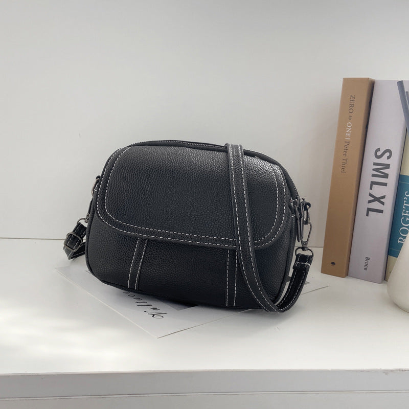 Kleine, runde Mini-Tasche aus PU