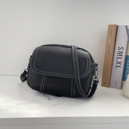 Kleine, runde Mini-Tasche aus PU